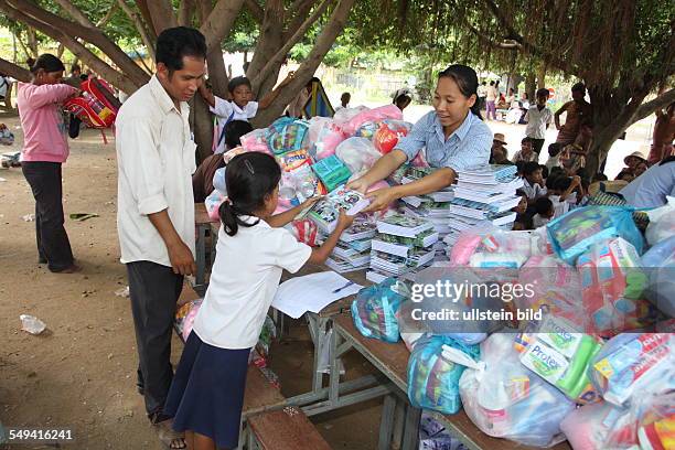 Cambodia, Phohm Penh. Collaborators of the Don Bosco Mission visit a village school in Prektaroan , which was opened 1992. Today there are 164...