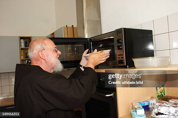 Germany, NRW, Werne: The oldest Capuchin monastery in the Rhenish-Westphalian Capuchin's province. Monk preparing lunch for his brothers.