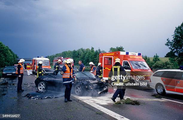 Germany, North Rhine-Westphalia,0: A3.- An accident with an Alfa Romeo-Spider Cabrio; clear-up operation.