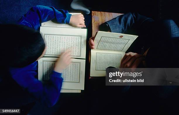 Germany, Bottrop: Koranic school at the weekend in the association of the Islamic Community Cologne . Community in Bottrop-Welheim; boys group during...