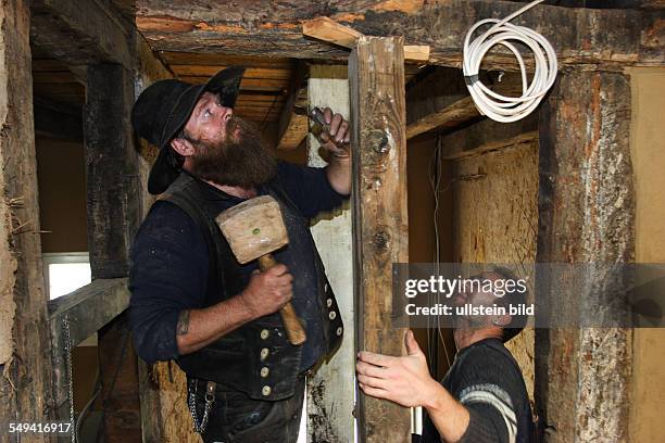 Germany, NRW, Hattingen: Restoring an old half-timbered house. This house gets restored by means of traditional and historical technics of manual...