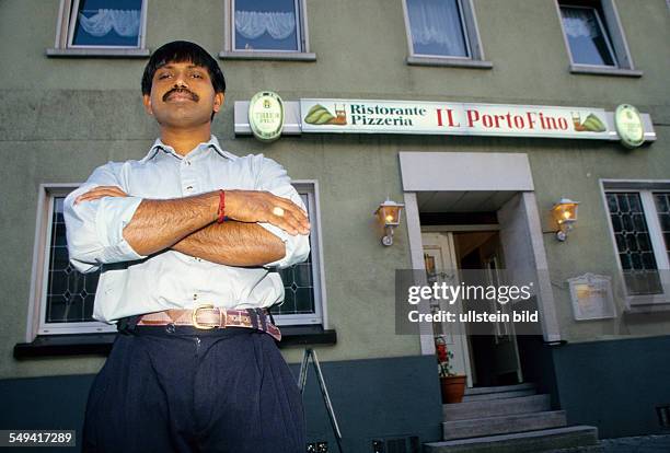 Germany, Hamm, 1999: Hindu-Tamils in Germany.- A Tamil businessman; pizzeria-restaurant.