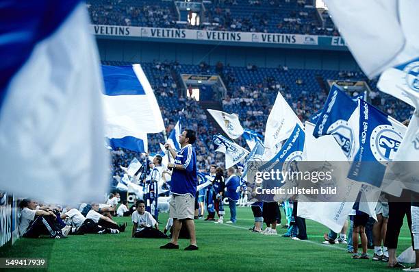 Germany, Gelsenkirchen: Schalke 04 Arena.- Opening event 2001; fanatics in the arena.