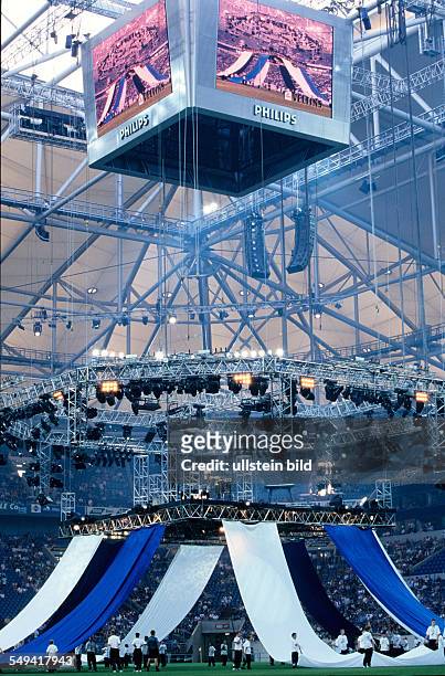 Germany, Gelsenkirchen: Schalke 04 Arena.- Opening event 2001; a video screen and a suspension stage.