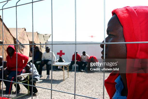 Spain, Melilla: Centro de Estancia Temporal de Inmigrantes CETI in the spanish exclave. Migrants behind a fence