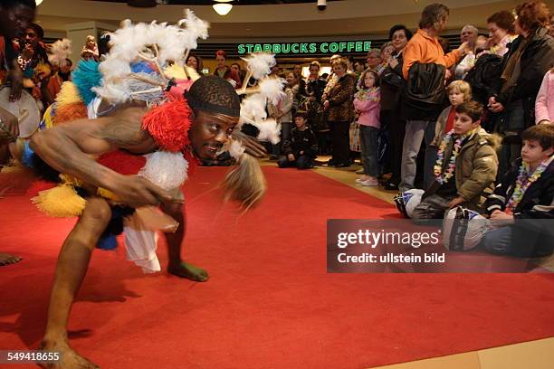 Germany, Muelheim: The Mibola group coming from Togo and from Benin and dancing in the Karstadt Arcades wearing Zangbeto dresses.