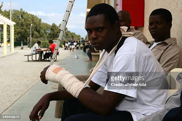 Spain, Ceuta: Injured migrants in the Centro de Estancia Temporal de Inmigrantes CETI in the spanish exclave.
