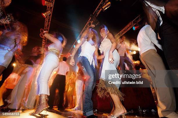 Germany, Bochum, 06.2002: Turkish Nights in the Ruhr Area.- Europes greatest Turkish discotheque TAKSIM ; a young female Turk and her Italian friend...