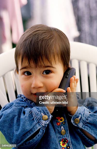 Germany: A little girl with a mobile phone.