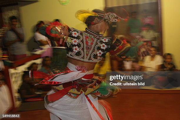 Sri Lanka, Kandy. A buddhist healing- and excorzist ceremony. Since 200 years in the fourth generation the Kaggadiya practise exorcism and astrology....