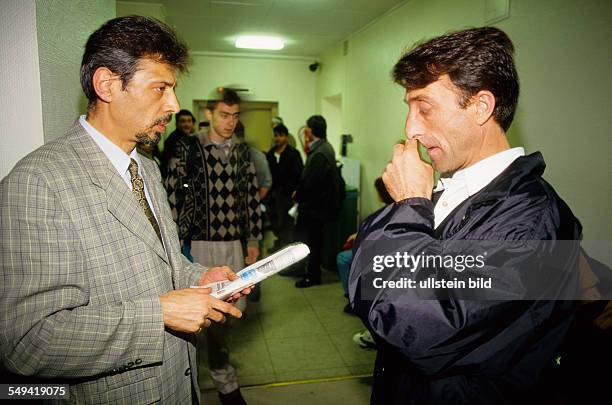 Germany, Wuppertal, 1998: Persons waiting in the aliensregistration office.