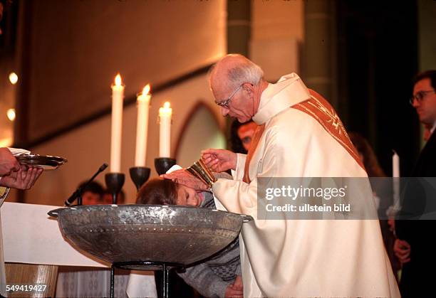 Germany, Luenen, 1999: Baptism of foreigners during the Easter mass, St. Marien Church.