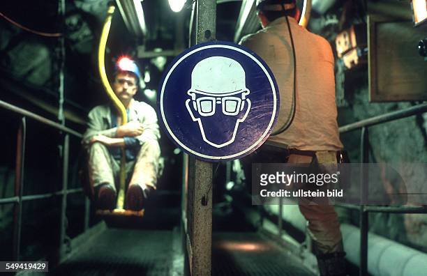 Germany, Hamm: Chair-lift, colliery Haus Aden Monopol. Sign "requirement to wear a helmet and a goggles"