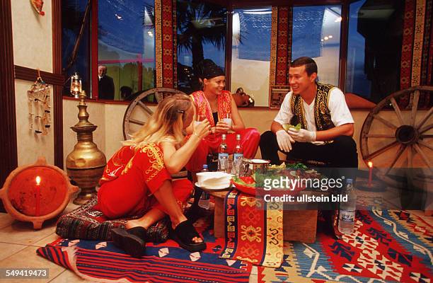 Turkey, Belek, 09.2002: Sirene Golf Hotel.- Turkish Evening, eating in traditional clothes.