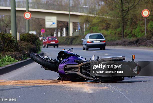 Germany, Essen, : Accident.- A motorcyclist collided with a car.