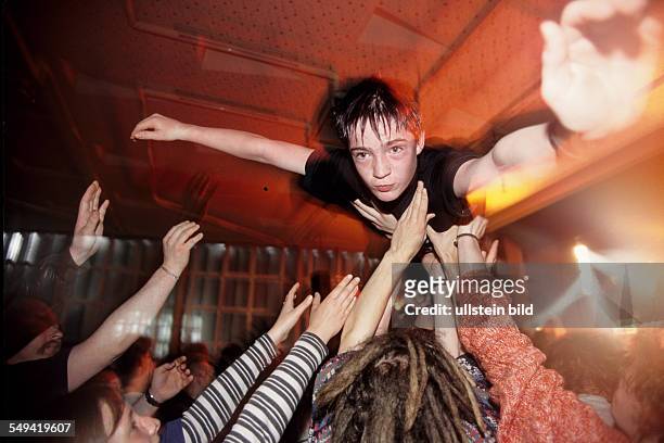 Germany, Essen, 1998: Stage-Diving during a concert.