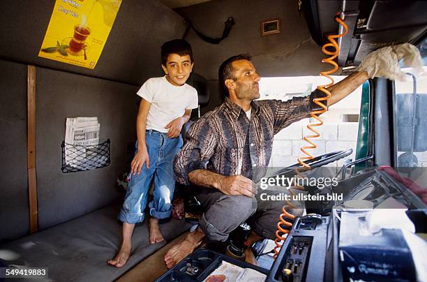 Turkey, Turkey on its way to Europe. A truck, which transports goods into the Iraq. A truck driver with his son