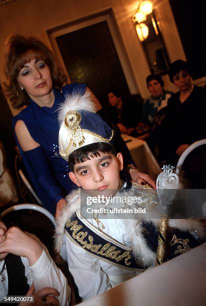 Germany, Dortmund, 1999: Turkish circumcision s ceremony, mother and son.