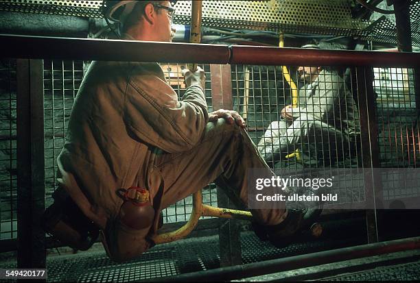 Germany, Hamm: Chair-lift, colliery Haus Aden Monopol. Sitting workers