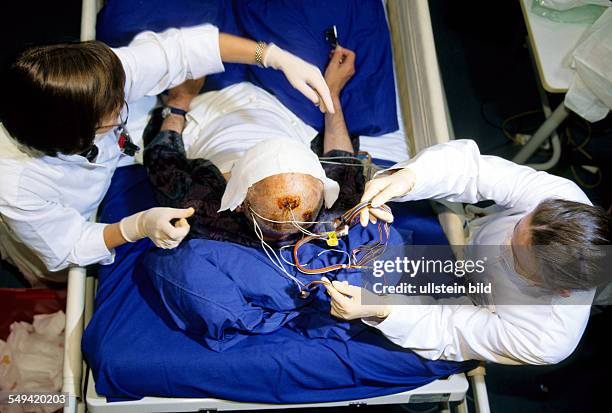 Germany, Bonn, The University of Bonn Department of Epileptology, connection of an electronic plate for measuring the electric brain activity