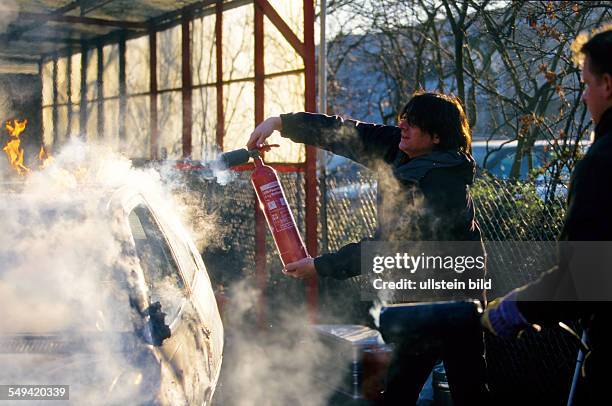 Germany, Duesseldorf: Childrens stunt.- Actors school MK Movie Kids; the burning car is directly extinguished after the short stunt.