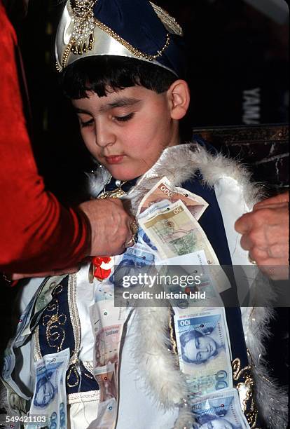 Germany, Dortmund, 1999: Turkish circumcision s ceremony, money presents to the boy.