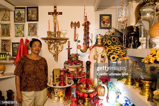 Netherlands Antills, Curacao, Willemstad. A Voodoo priestress in her Altar-room, Shango area