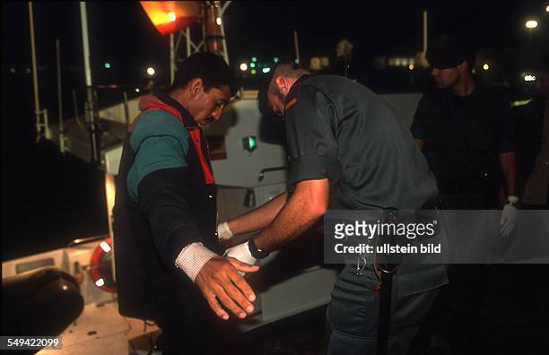 Spain, Tarifa: Africans try to immigrate over the straits of Gibraltar. The refugees are arrested in the port of Tarifa by the Guardia Civil.