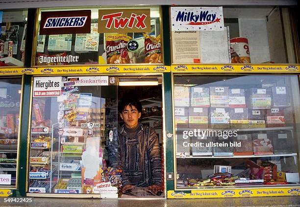 Germany, Luenen, 1998: Turkish businessmen in Germany.- A kiosk, the son selling.