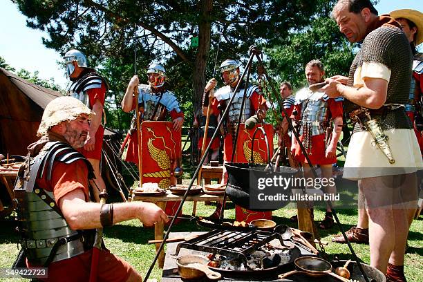 Germany, Xanten - The Archeological Park. This event is called SWORDS, BREAD AND GAMES. The participants live two days long how they imagine Roman...