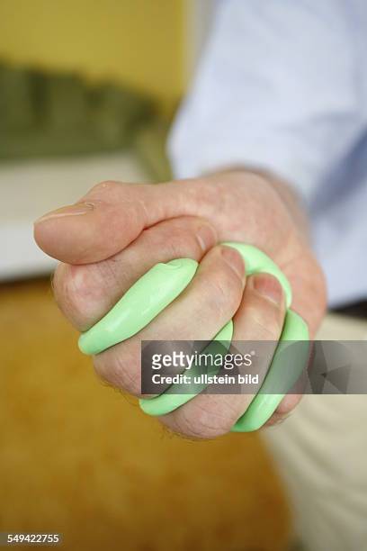 Germany: Therapy plasticine. A patient during the therapy for the hands with plasticine.