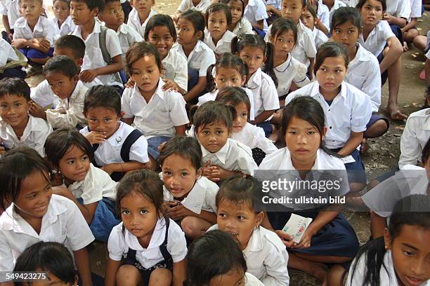 Cambodia, Phohm Penh. Collaborators of the Don Bosco Mission visit a village school in Prektaroan , which was opened 1992. Today there are 164...