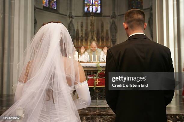 Germany: The wedding couple in front of the altar.