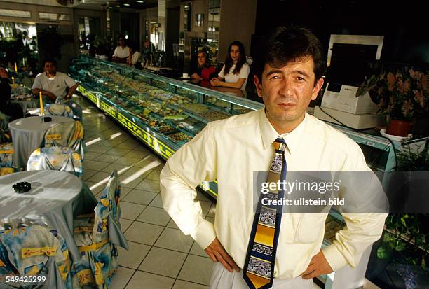 Germany, Duisburg, 1999: The manager of a cafeteria, confectionery, bakery.