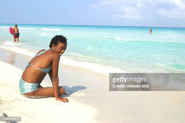 Cuba: Portrait of a Cuban woman at the beach.