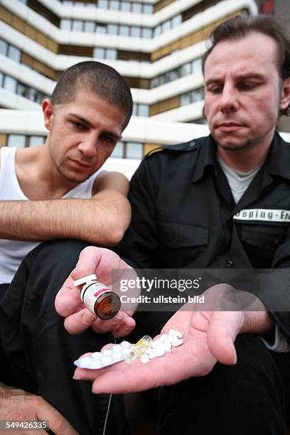 Germany, Wesseling: A young turkish man after his visit at the fitness studio. Joerg Boerjesson advices and informs him about anabolic steroids and...