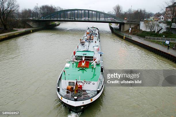 Germany: Inland navigation.- A ship driving through a canal.