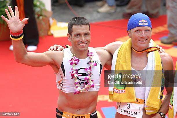 Germany, Frankfurt: Ironman. - Portraet of two participants after the competition.