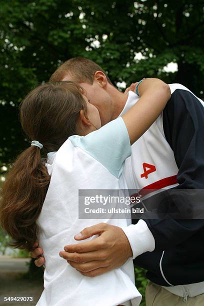 Germany, : Free time.- A couple kissing each other.