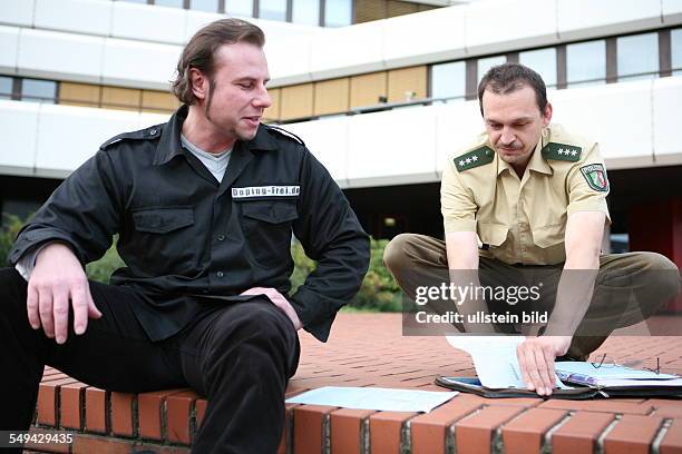 Germany, Wesseling: Joerg Boerjesson advices and informs young people about anabolic steroids and its effects. A policeman is confiscates the...