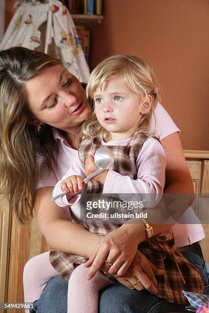 Germany, Essen: Portrait of a young mother with her little daughter.