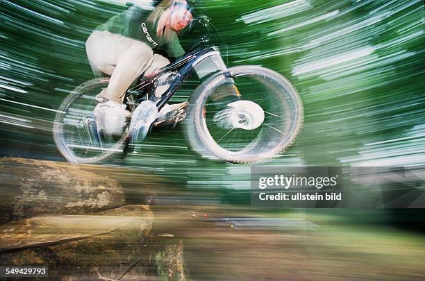 Germany: Free time.- Cyclists in the wood.