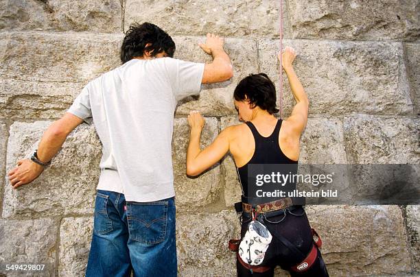 Germany: Free time.- Young persons climbing.