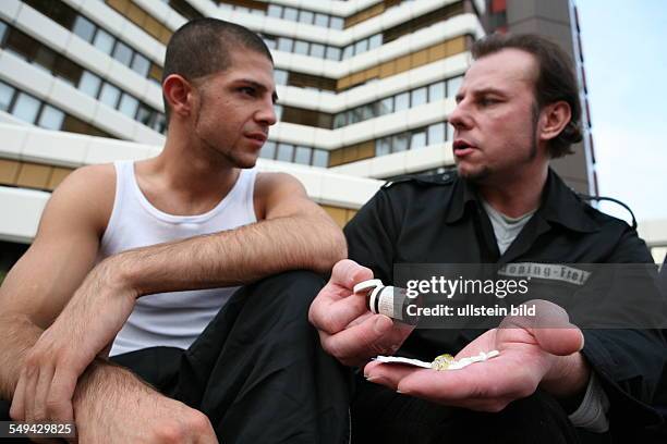 Germany, Wesseling: A young turkish man after his practise in a fitness studio. Joerg Boerjesson advices and informs him about anabolic steroids and...