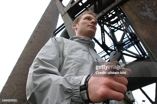 Germany, Duisburg: Nordic Walking.- A young man in the landscape park Duisburg-North. Model Release: Yes