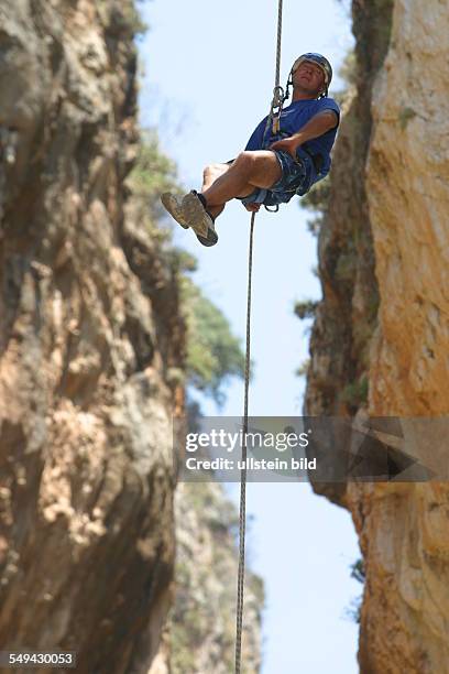 Turkey: A man during a climbing tour in the mountains.