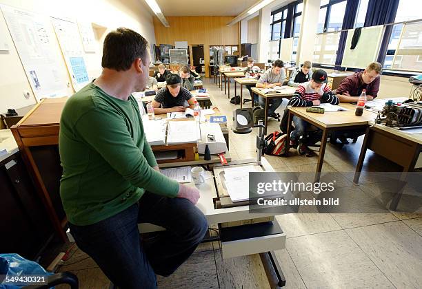 Apprentices in Electrical Engineering during lessons in a training centre in Bonn