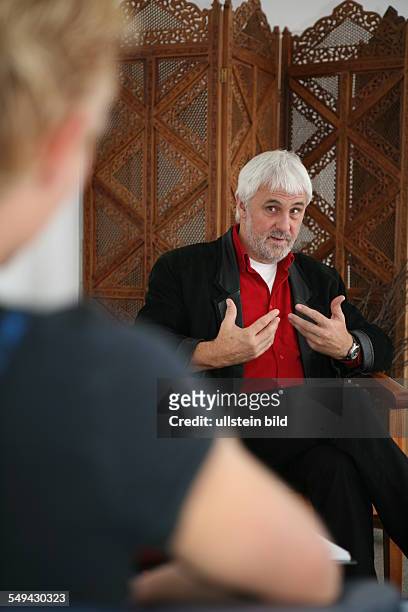 Germany, Wesseling: 2 young men during a talk with Werner Huebner, qualified psychologist, psychological psychotherapist.