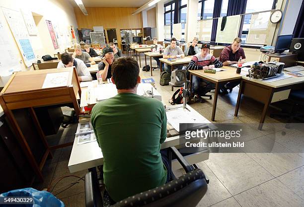 Apprentices in Electrical Engineering during lessons in a training centre in Bonn