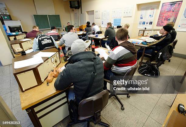 Apprentices in Electrical Engineering during lessons in a training centre in Bonn